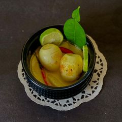 A picture of Gondhoraj Dim / Eggs with Kafir Lime.