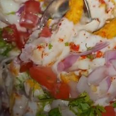 A picture of Kurkure Dahi Chat.