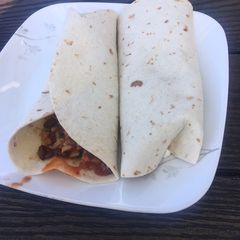 A picture of Tofu,black bean and corn chili burrito.