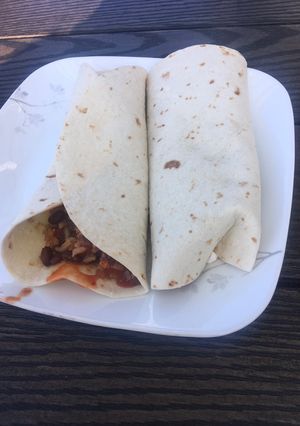 A picture of Tofu,black bean and corn chili burrito.