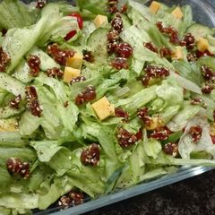 A picture of Simple salad topped with sesame Dates.
