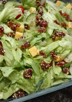A picture of Simple salad topped with sesame Dates.