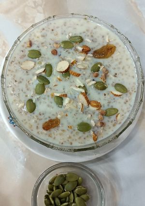 A picture of Broken Wheat Kheer with pumpkin seeds.