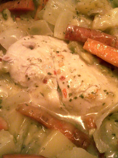A picture of baked chicken and vegetables.