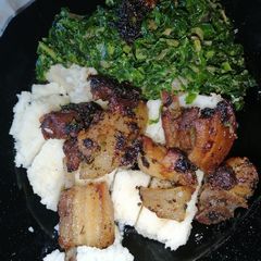 A picture of Fried pork with ugali.