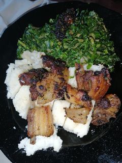 A picture of Fried pork with ugali.