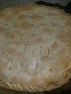 Una foto de Tarta de cebolla, jamón y queso