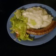 A picture of Pap with wors and lettuce.