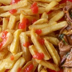 A picture of Chips with beef stew.