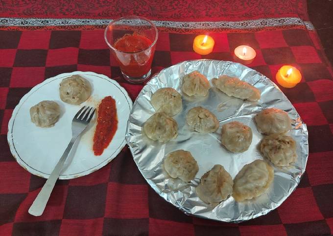 Chicken momos with spicy sauce