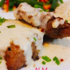 A picture of #Beef_Steak_with #White_Sauce and #Sauté_Vegetables.