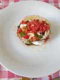 Melanzane grigliate con burrata di capra e pomodori