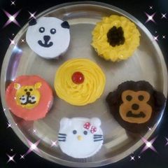 A picture of Emoji animals cupcakes eggless.