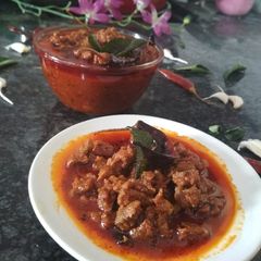 A picture of Mutton pickle (gosht ka achar).
