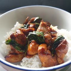 Soy basil chicken with steam rice A picture of Soy basil chicken with steam rice.