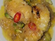 Una foto de naranjas en salsa picante