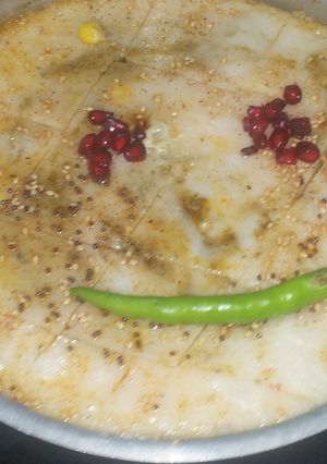 A picture of White dhokla stuffing with corn and spinach.