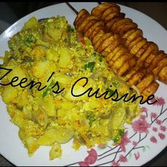 Fried Plantain with Potato Egg Sauce 😋 A picture of Fried Plantain with Potato Egg Sauce 😋.