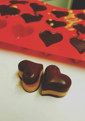 A picture of Keto (Low Carb High Fat) Dark Chocolate, Peanut Butter Fat Bombs.