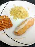 chicken roll with a cream spiced fillin, paprika rice, crispy potato slice & four cheese sauce