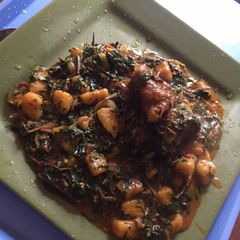 A picture of Plantain porriage with ugba and meat.