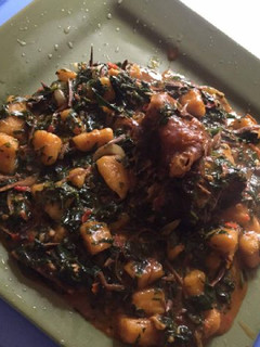 A picture of Plantain porriage with ugba and meat.