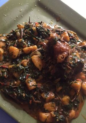 A picture of Plantain porriage with ugba and meat.