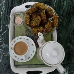 A picture of Chana Dal - Palak Pakoda with Shahi Chai.