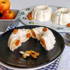 A picture of Carrot Halwa in a Frozen Cashew Apple Phirni Mousse Cake.