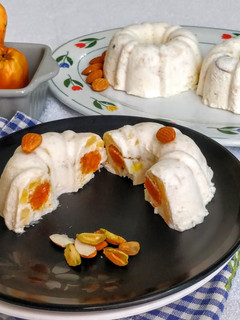A picture of Carrot Halwa in a Frozen Cashew Apple Phirni Mousse Cake.