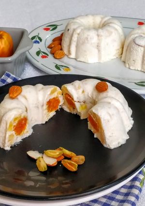 A picture of Carrot Halwa in a Frozen Cashew Apple Phirni Mousse Cake.