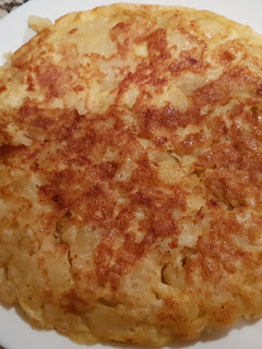 Una foto de Tortilla de patata cuajada con sal y pimienta