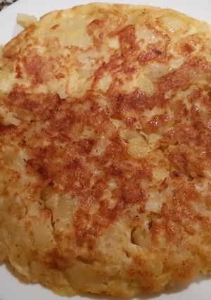 Una foto de Tortilla de patata cuajada con sal y pimienta