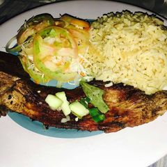 A picture of Simple braaied pork with salad.