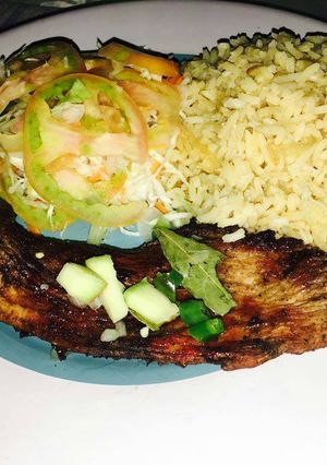A picture of Simple braaied pork with salad.