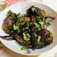 A picture of Methi Toovar (Pigeon Peas) stuffed Eggplant.