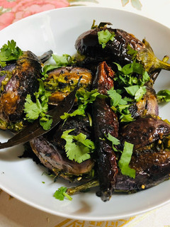 A picture of Methi Toovar (Pigeon Peas) stuffed Eggplant.