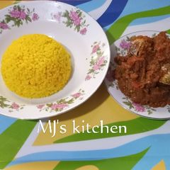 A picture of Turmeric rice and fish sauce.