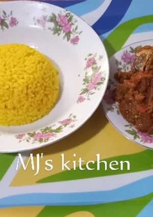 A picture of Turmeric rice and fish sauce.