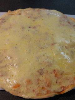 Una foto de Pizza con Muzzarella
