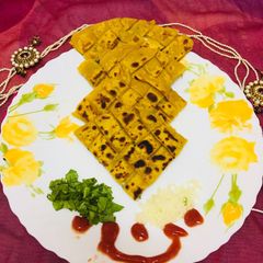 A picture of Checks spinach cheese paratha.