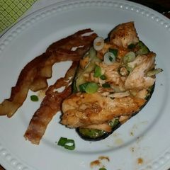 A picture of Baked Egg in Avocado with Brie and Salmon.