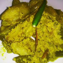 A picture of Pointed groud with coconut and mustard paste.
