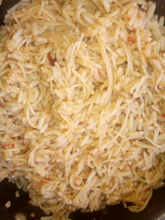 A picture of Simple jollofrice with spaghetti.