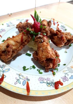 Una foto de Alitas de pollo fritas
