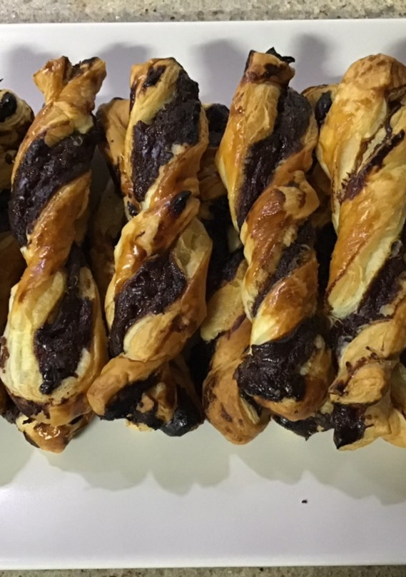 Una foto de Ricitos de hojaldre con crema de chocolate