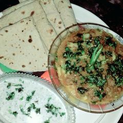 A picture of Aalo qeema with raita.