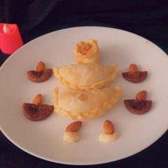 A picture of Oats and dryfruits gunjiya.