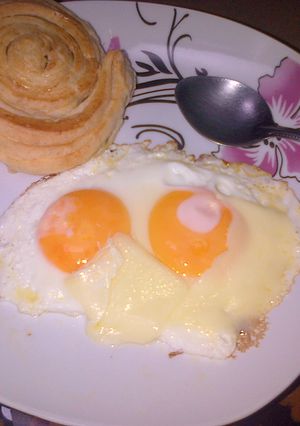 Una foto de Huevos con queso derretido