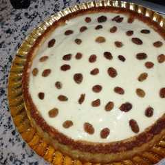 Una foto de Tarta de yogur con almíbar de naranja toronja y crema pastelera